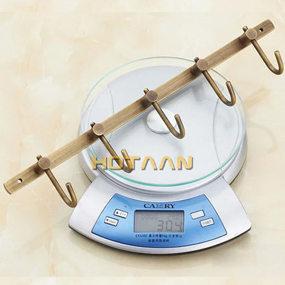 خطاف رداء من النحاس العتيق من DecorBites™، أدوات حمام لتنظيم أنيق