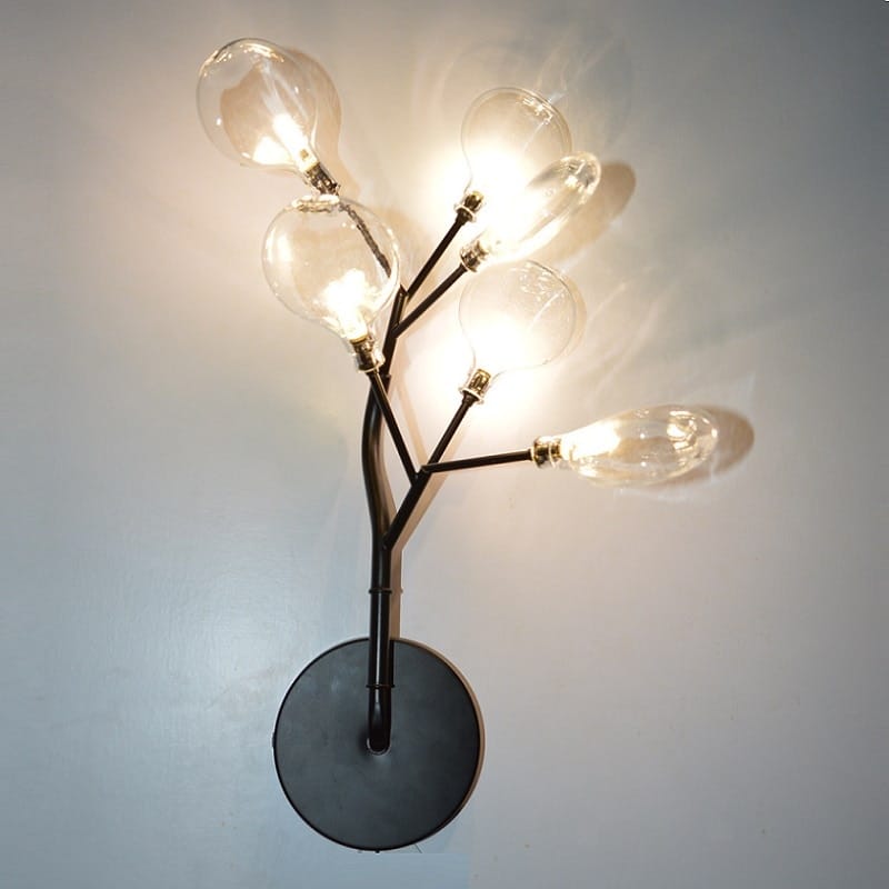 Modern gold firefly tree branch led wall light featuring a black metal wall sconce with five clear glass bulb branches resembling a tree for bedroom use.