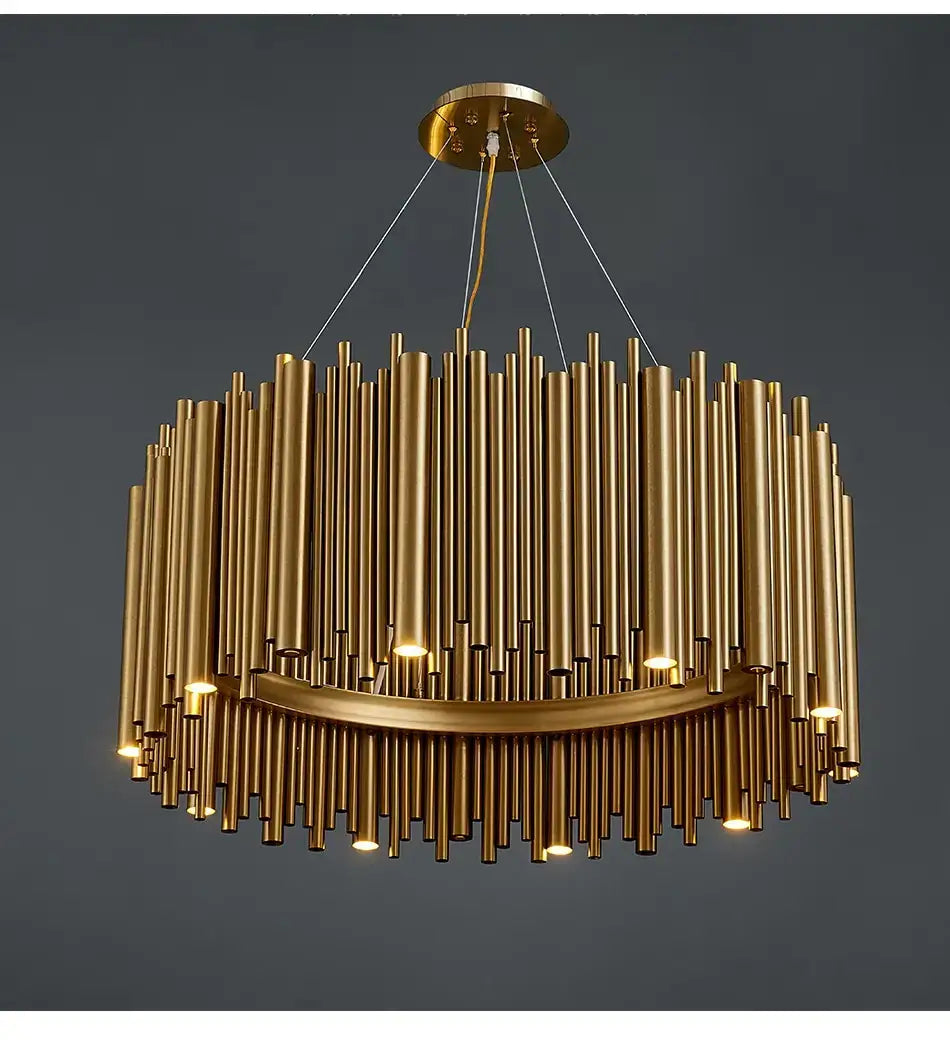 Luxury modern round gold chandelier with vertical cylindrical rods and a curved lower ring emitting warm light for living room use