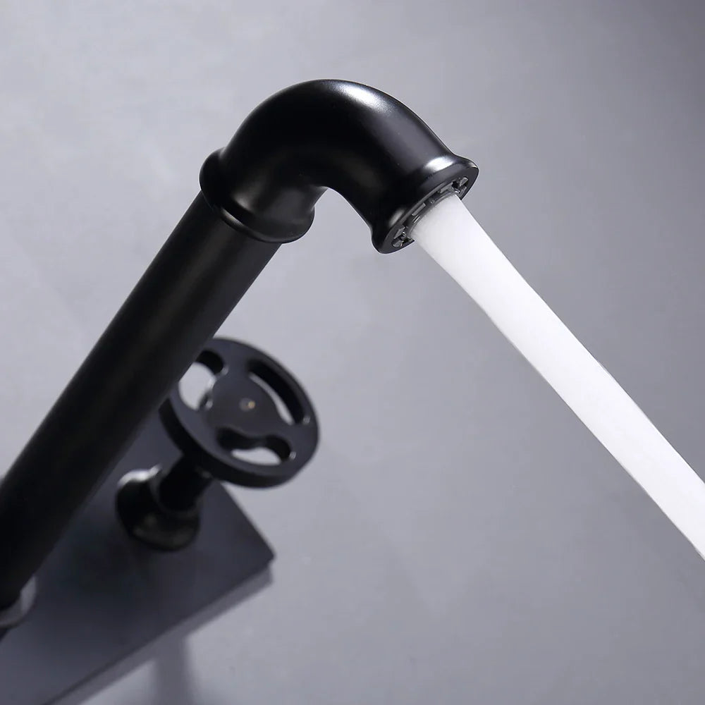 Grifo de lavabo de pared DecorBites™ de estilo industrial, color negro, con doble manija