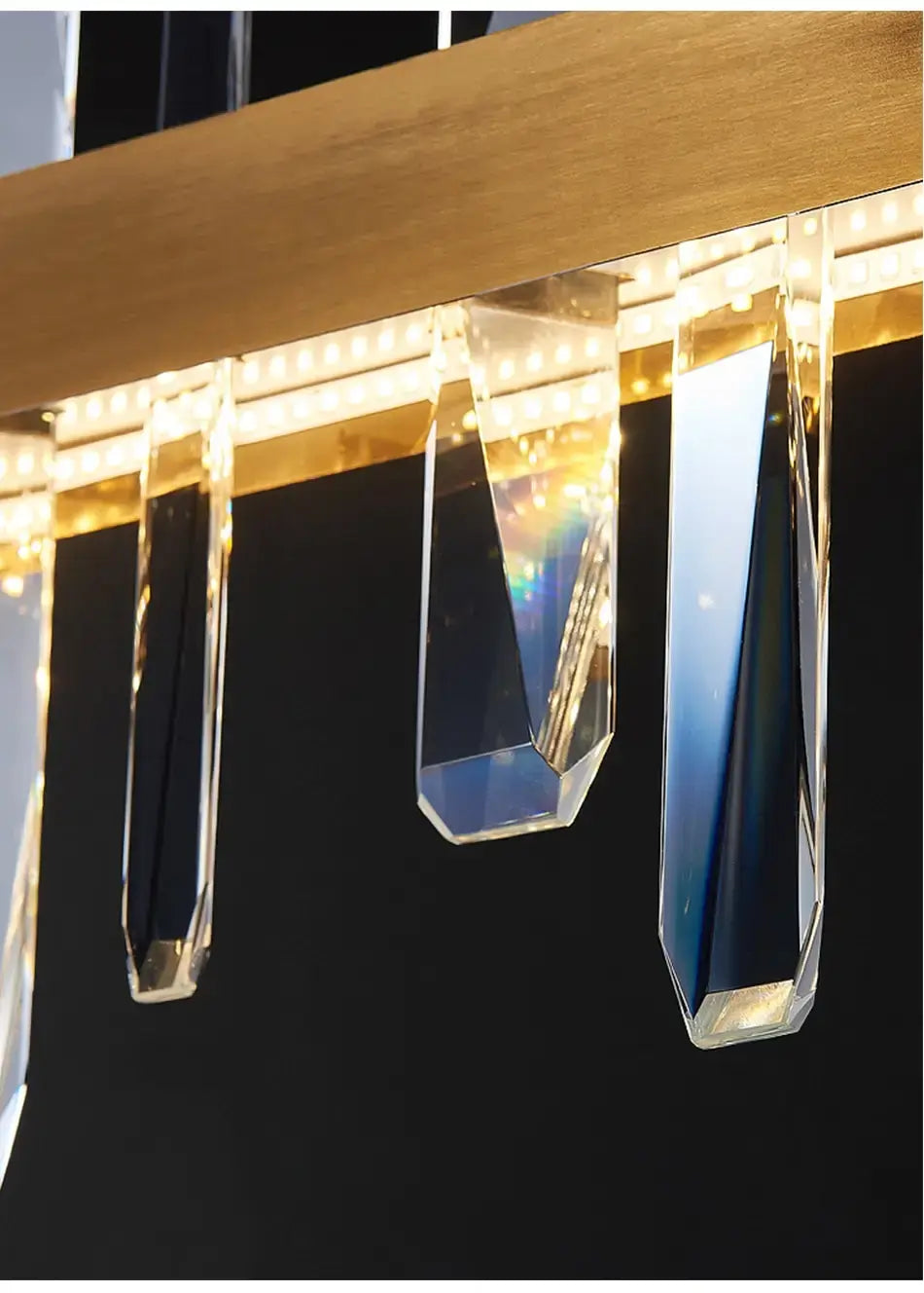 A modern rectangle gold crystal chandelier featuring faceted crystal prisms suspended from a warm-toned wooden beam with integrated led lights for dining room illumination.