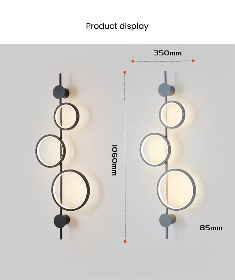 Modern black linear long led wall light features a sleek minimalist black metal frame with three circular glass shades emitting warm light for living room use.