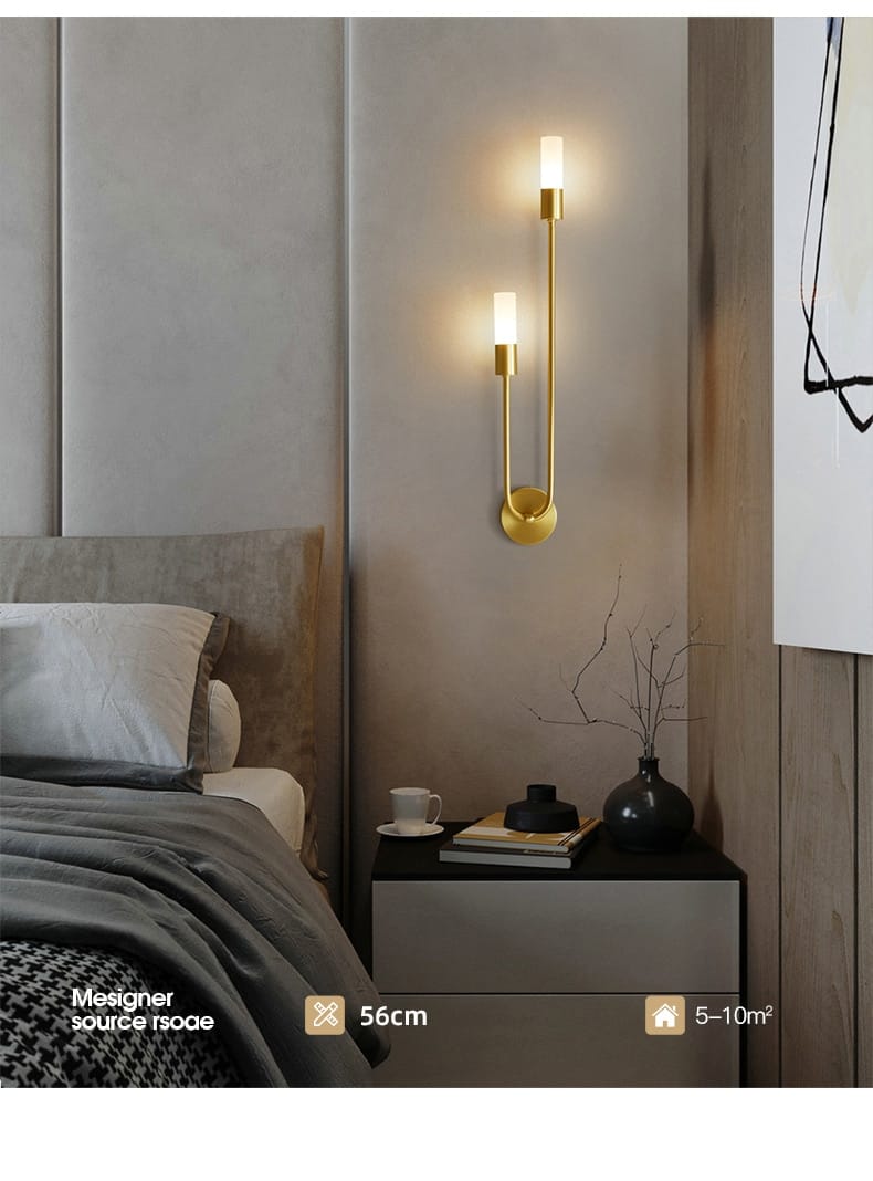 modern gold minimalist led wall lamp with two vertical candle-style led wall lights featuring a sleek and elegant design for bedroom use