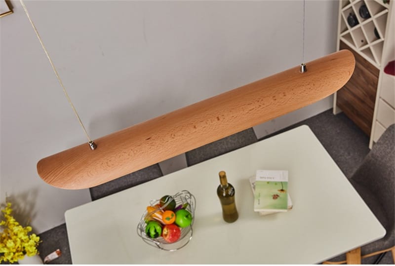 A sleek light brown wooden pendant lamp with smooth curved design and visible wood grain for modern brushed gold kitchen island light fixtures chandelier wood chandeliers kitchen.