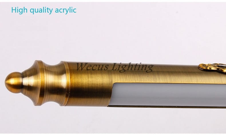 Antique bronze ornate led mirror lamp for bathroom wall decor featuring a gold-colored brass-finished led penlight with a translucent acrylic body and engraved wecus lighting branding.