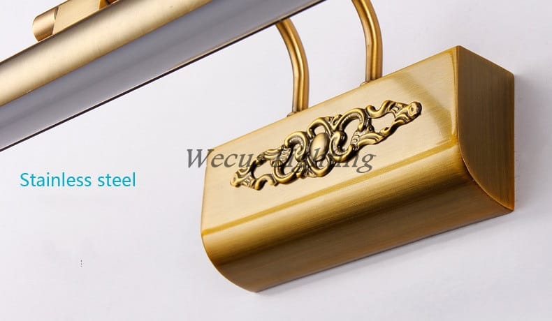 Gold-finished stainless steel door handle with ornate scrollwork detailing designed for antique bronze ornate led mirror lamp bathroom wall decor.