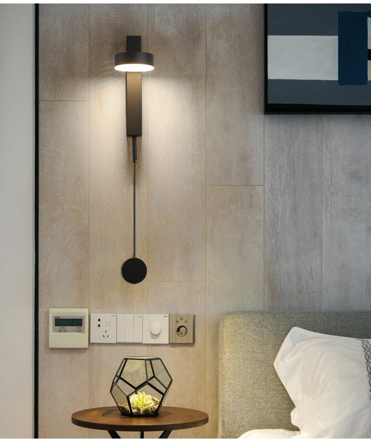 Modern black wall lamp with sleek minimalist design and adjustable pull cord for lighting control, ideal as a modern led wall lamp for bedrooms with rotating sconce light.