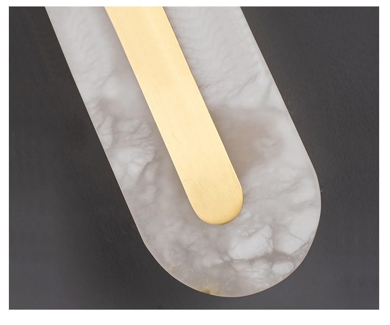 postmodern gold copper marble wall lamp featuring a gold-colored rectangular bar resting on a gray marble surface for living room use