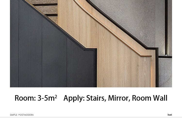 Modern minimalist gold led wall lamp bedroom cylindrical sconce installed near a modern staircase with a curved wooden handrail and dark gray paneling.