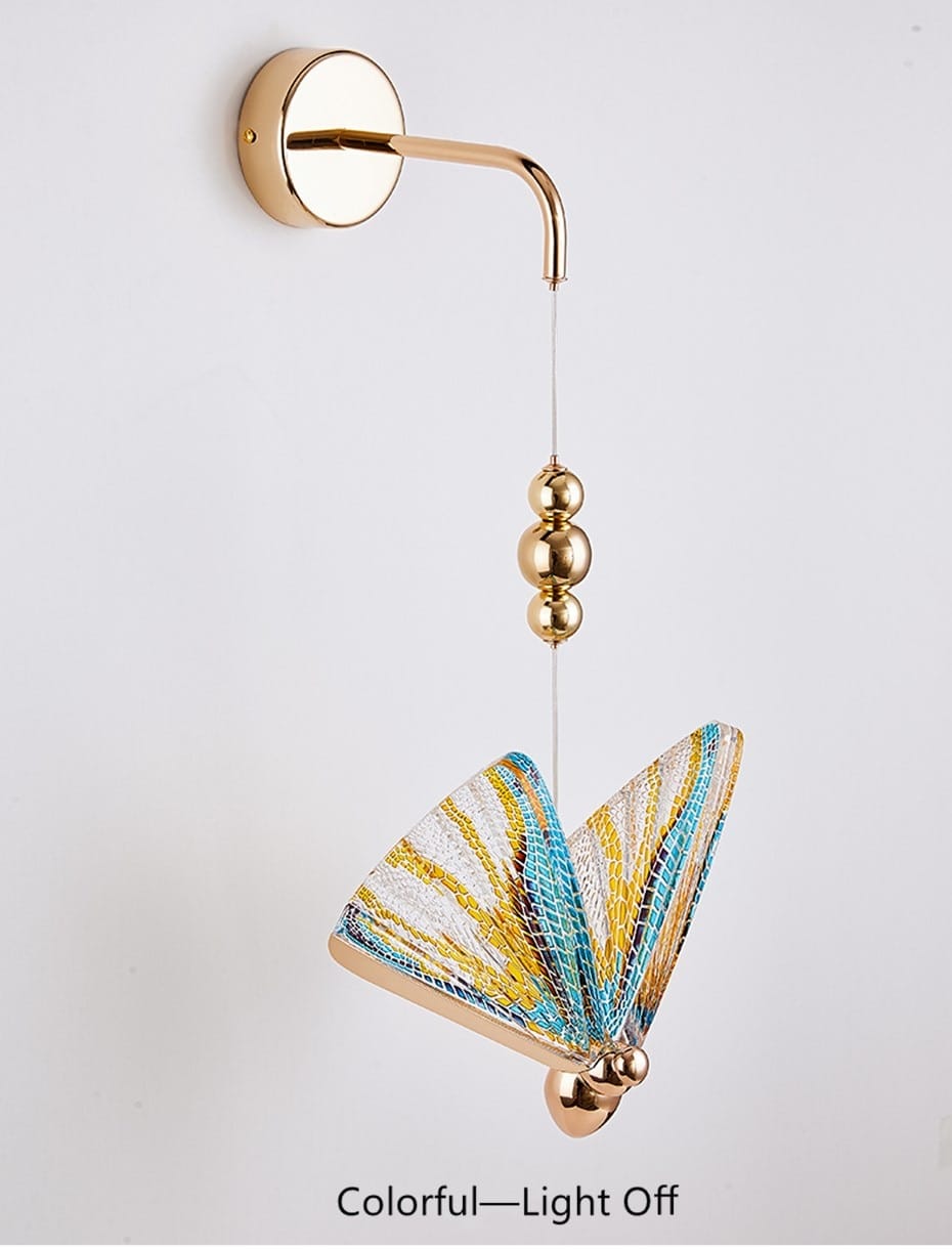 gold and patterned butterfly led wall light featuring gold-toned metal accents and vibrant turquoise yellow and white wings as a nordic butterfly led wall light for bedroom use