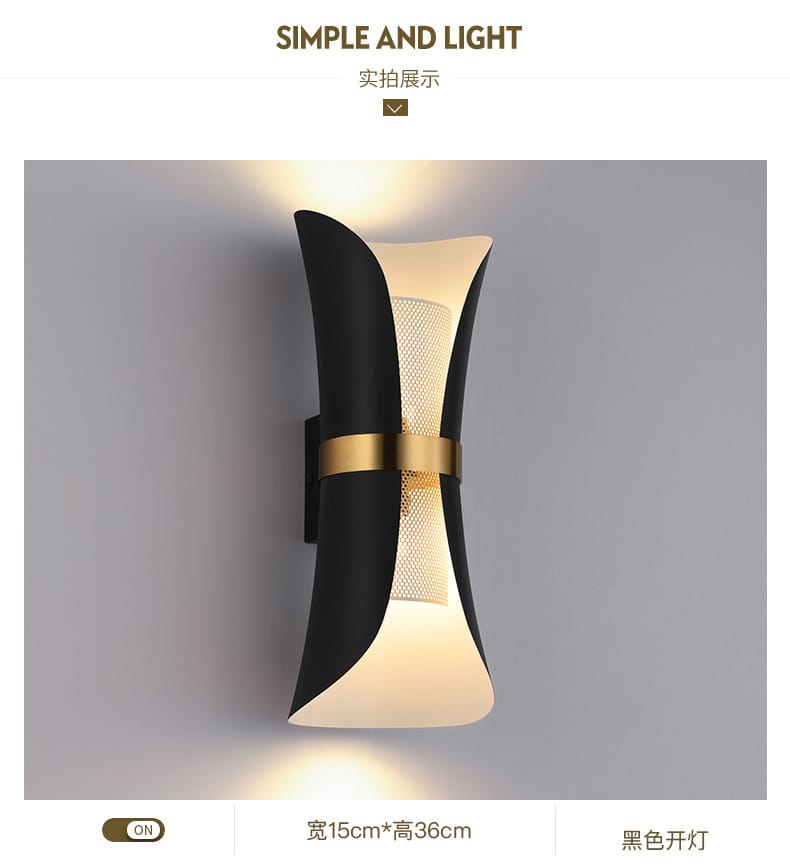 Modern black and gold curved wall lamp with a sculptural design and mesh panel emitting warm light for bedroom use.