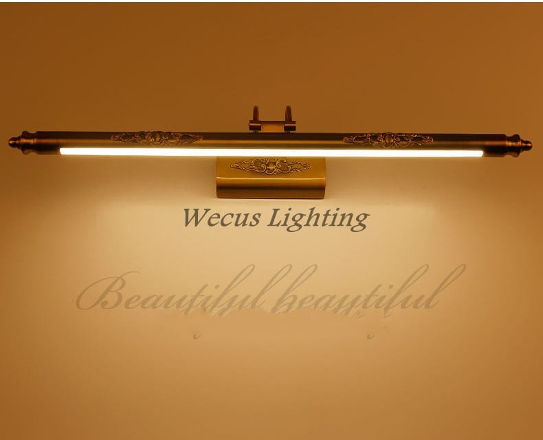antique bronze ornate led mirror lamp with brass finish and floral engraving featuring a warm glowing led strip designed for bathroom wall decor.