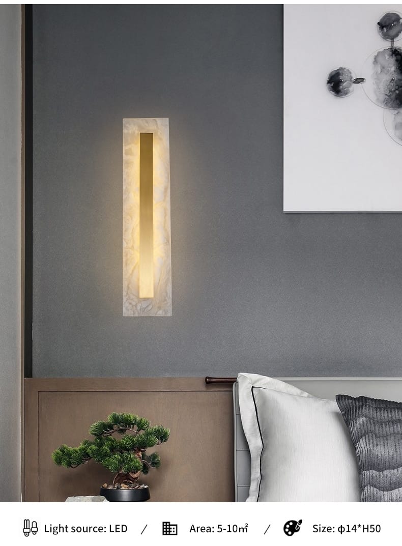 a sleek rectangular wall lamp with warm golden light centered within a polished copper marble wall frame designed as a postmodern marble wall lamp for the living room