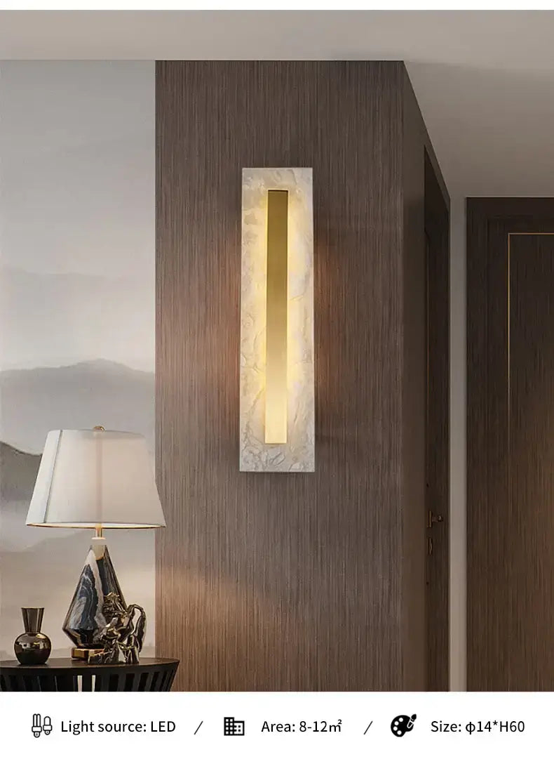 modern rectangular wall lamp featuring a sleek polished gold central strip set within a textured white copper marble wall frame ideal for living room decor.