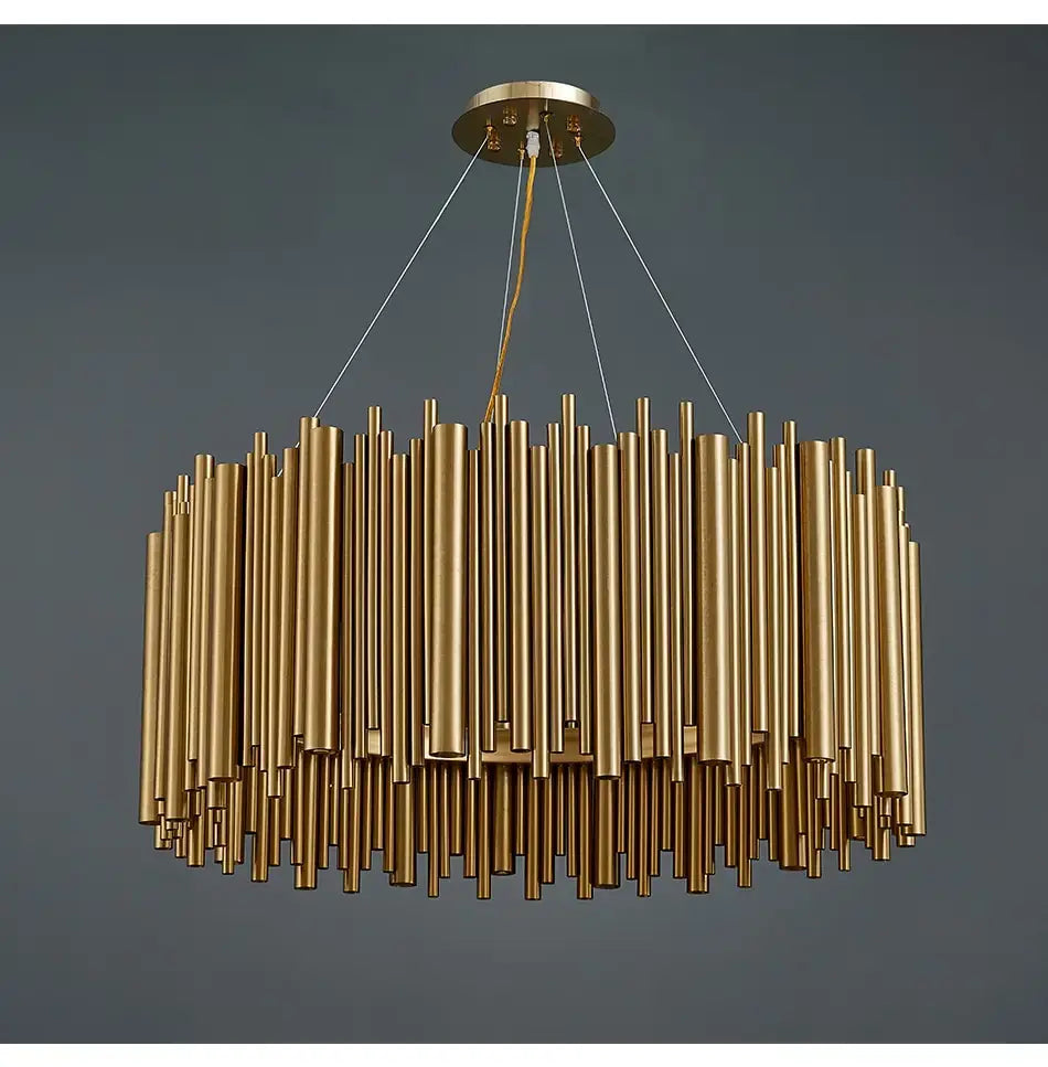 Luxury modern round gold chandelier featuring a circular ceiling mount with numerous vertical cylindrical rods of varying lengths designed for a living room setting.