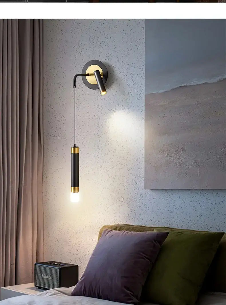Modern black and gold wall sconce with a sleek minimalist design perfect for a minimalist creative luxury bedroom or luxury bedroom bedside lighting.
