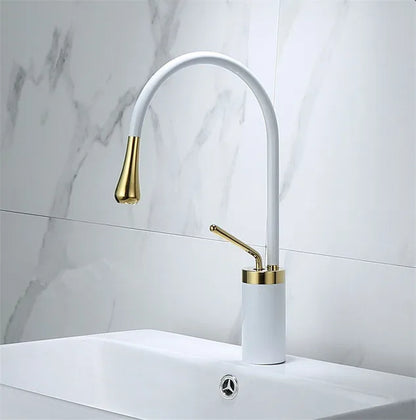 Grifo de lavabo DecorBites™ en oro cepillado/negro/blanco con monomando giratorio y manguera de desagüe.