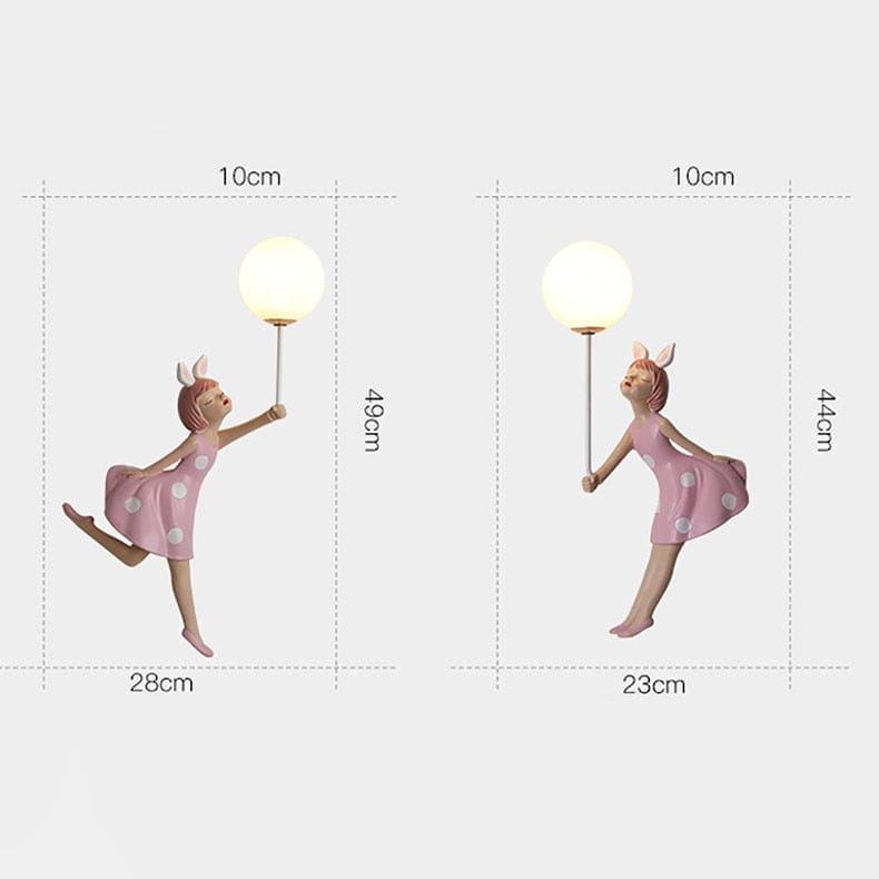 whimsical pink polka dot fairy girl wall lamp figurine holding a spherical lamp designed as a girl wall lamp for bedroom use
