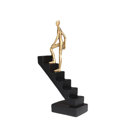 DecorBites™ Escultura abstracta de hombre dorado escalando escaleras Adornos para el hogar