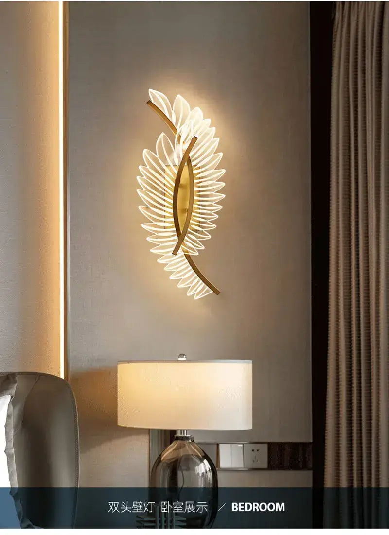 gold-toned leaf-shaped wall lamp featuring a layered petal design illuminated in nordic modern art style for modern art bedside use.