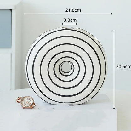 Jarrón de cerámica DecorBites™ con rayas geométricas y recortes redondos para decoración del hogar