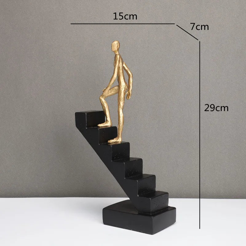 DecorBites™ Escultura abstracta de hombre dorado escalando escaleras Adornos para el hogar