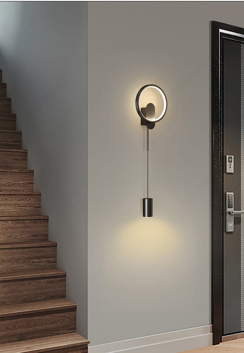 Modern nordic led wall lamp bedroom sconce in black gold featuring a sleek black metal frame and warm ambient lighting in a circular design.