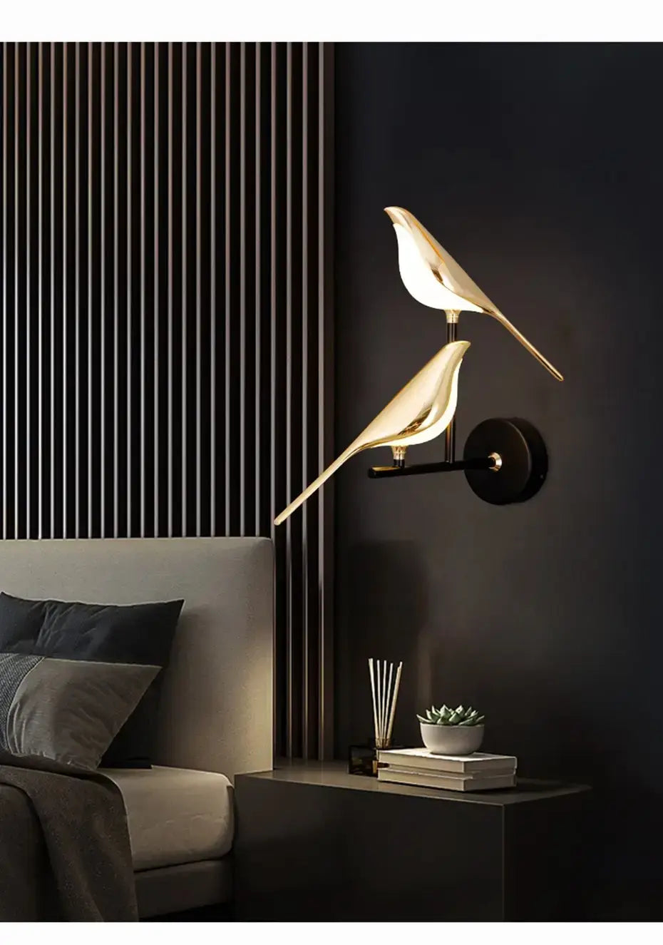 Gold-toned bird-shaped wall lamp with a sleek minimalist design and crystal accents for bedroom bedside wall lighting.