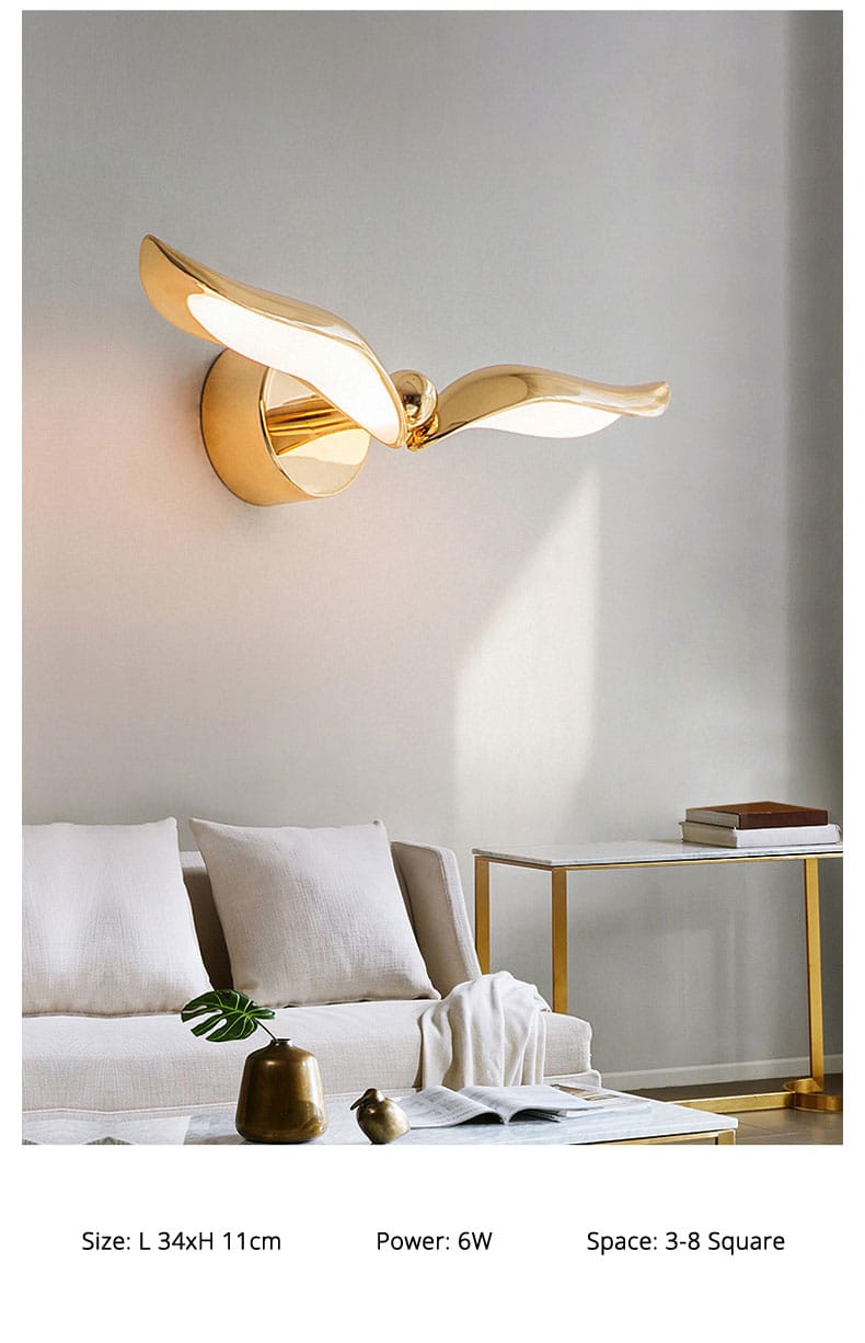 Luxury minimalist creative seagull wall lamp in gold color with stylized bird design and sleek wing-like arms for bedroom and living room.