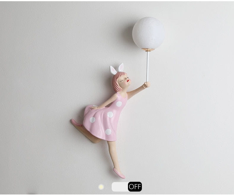 Whimsical pink polka dot fairy girl wall lamp featuring a white spherical bulb designed as a decorative girl wall lamp for bedroom use.