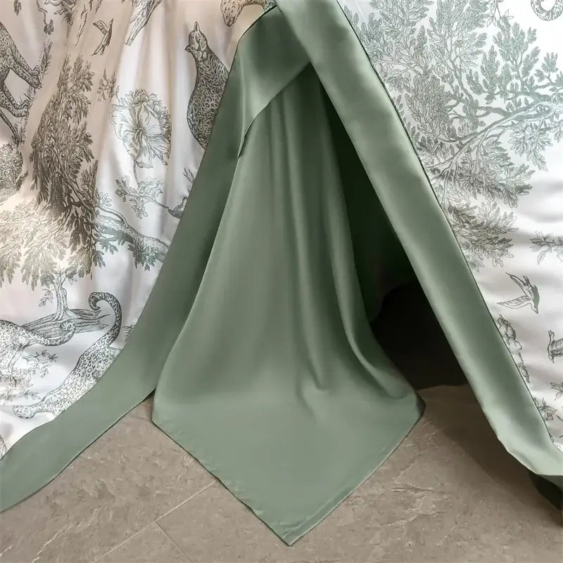 a sleek silver zipper on a eucalyptus fiber duvet cover with white fabric track set against sage green bedding