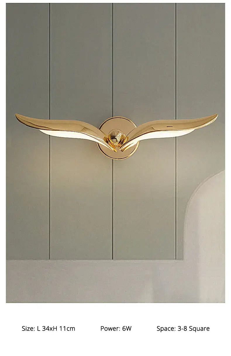 gold-colored luxury minimalist creative seagull wall lamp shaped like a bird with outstretched wings for bedroom and living room lighting