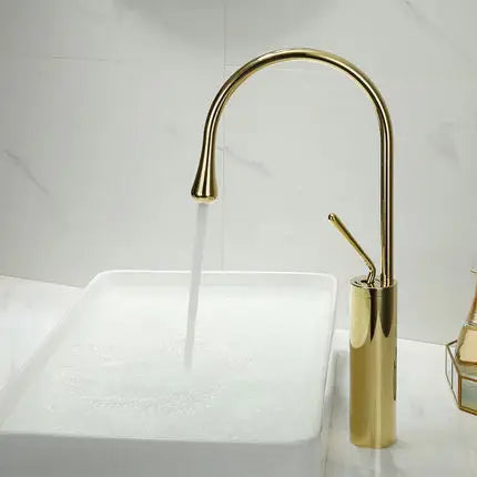Grifo de lavabo DecorBites™ en oro cepillado/negro/blanco con monomando giratorio y manguera de desagüe.