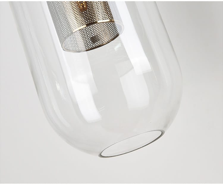 Clear glass pendant light with metallic mesh shade featuring a brass frame for nordic modern decor glass lampshade ideal for bedroom use.