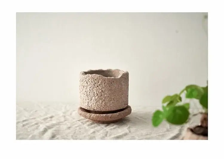 Rustic beige handcrafted ceramic vase with a textured speckled surface and matching saucer for flowers by DecorBites