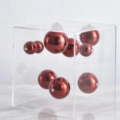 أعمال فنية تجريدية من DecorBites™ على شكل كرات معدنية في صناديق أكريليك شفافة