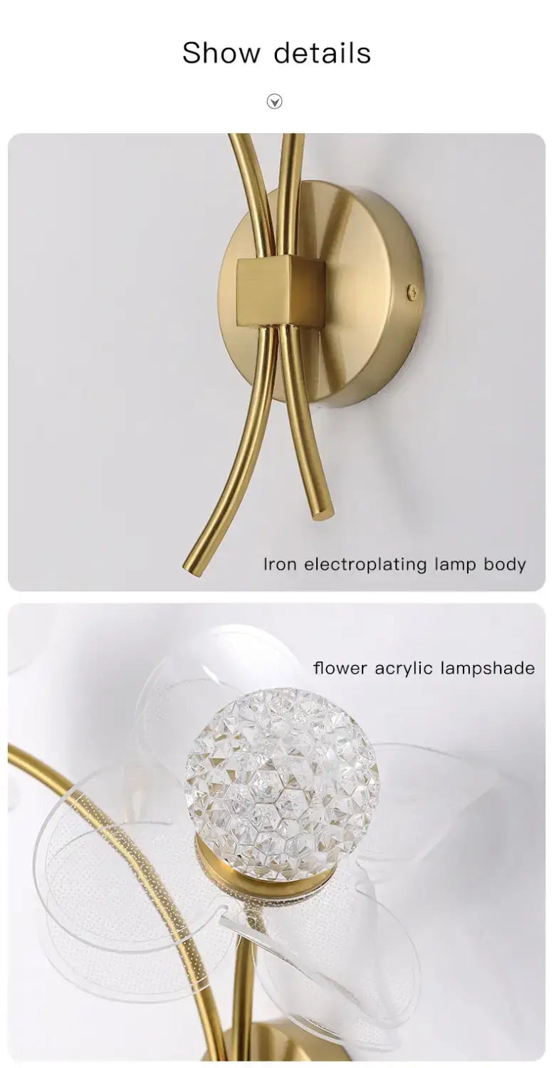 Creative floral decorative gold led wall lamp featuring a gold-colored iron electroplated base with a clear crystal-encrusted flower-shaped acrylic shade for bedroom use.