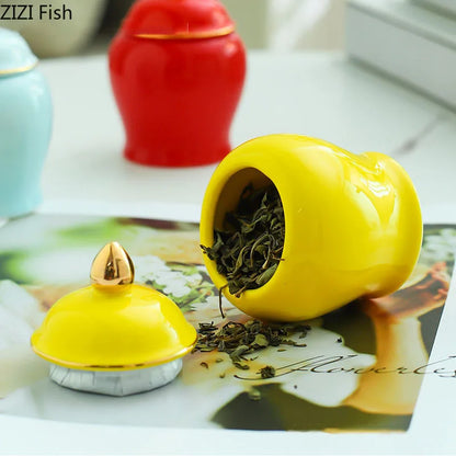 Tarro de cerámica DecorBites™ dorado para té con tapa, ideal para decorar el escritorio.