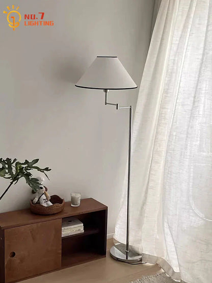 Lámpara de pie LED DecorBites™ color crema con brazo oscilante para espacios de vida modernos