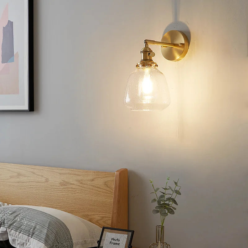 Gold-toned wall sconce with amber textured clear glass shade for bedroom decorbites clear glass pull chain light