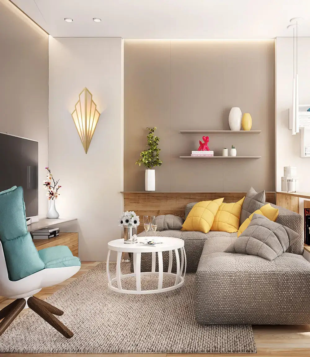 gray textured sectional sofa with yellow and gray throw pillows beneath an art deco gold diamond shape modern wall light for bedroom use