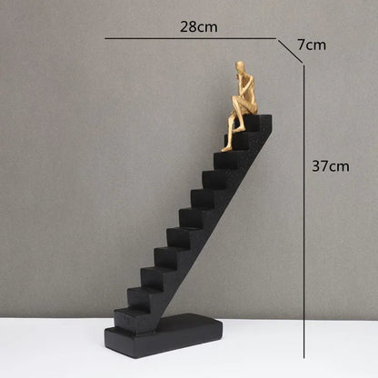 DecorBites™ Escultura abstracta de hombre dorado escalando escaleras Adornos para el hogar