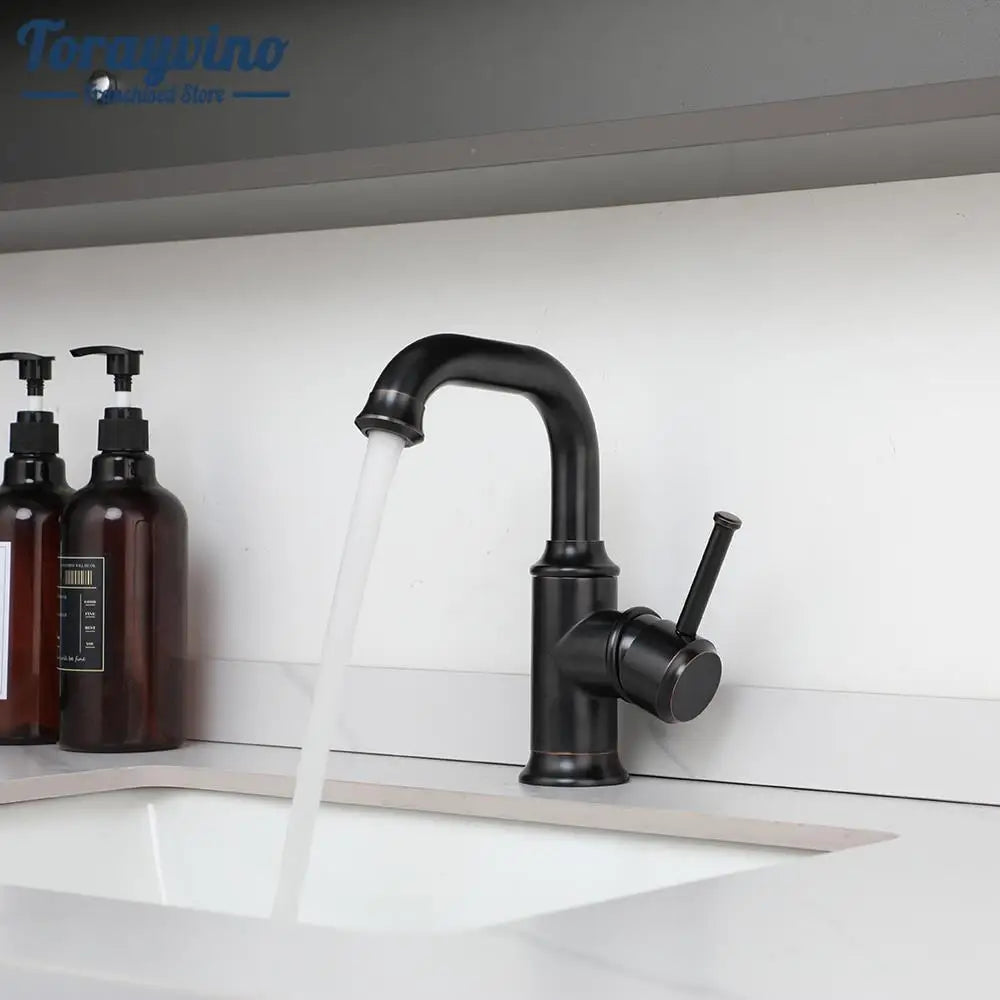 صنبور حمام DecorBites™ من النحاس العتيق/البرونز المصقول بالزيت، مثبت على السطح، بمقبض واحد