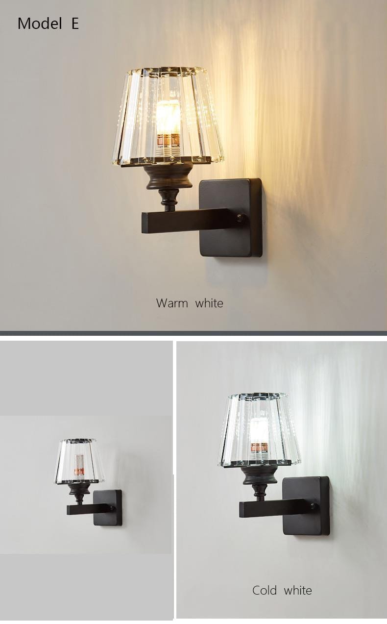 modern minimalist wall sconce with a black metal frame and clear faceted glass shade emitting warm or cold white light for bedroom lighting.