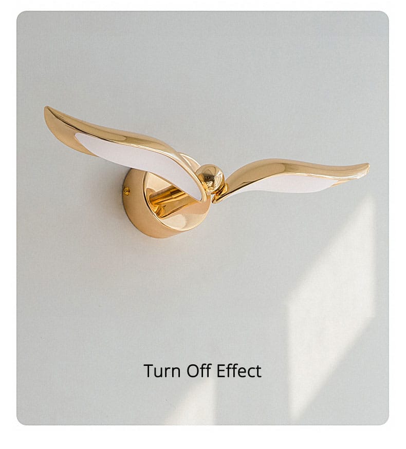 luxury minimalist creative seagull wall lamp featuring gold-colored sleek wing-like arms and a central spherical accent for bedroom and living room use