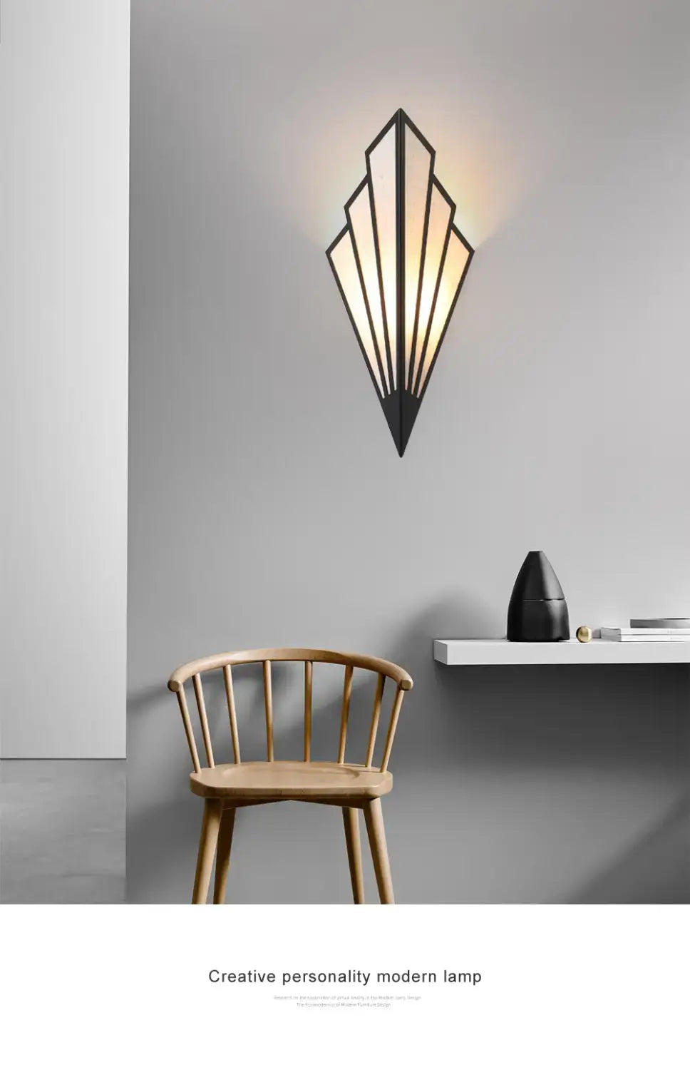 black metal art deco-style wall light with geometric fan design and warm glowing light featuring diamond shape modern elements for bedroom use