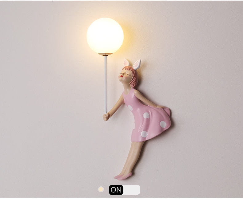 whimsical pink polka dot fairy girl wall lamp featuring a spherical white light fixture designed as a girl wall lamp for bedroom decor