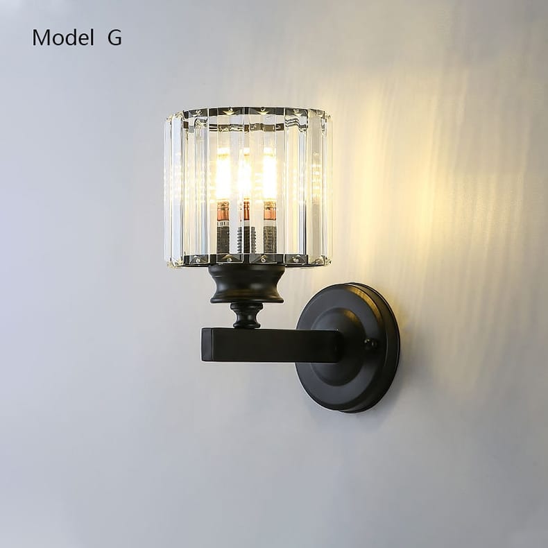 Modern minimalist wall lamp featuring a black metal base with a crystal glass shade designed as a minimalist wall lamp for bedroom use.