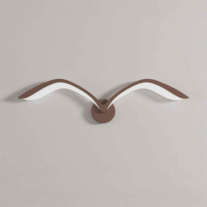 Brown and white seagull-shaped wall lamp with sleek minimalist nordic avian style design for indoor bedroom use.