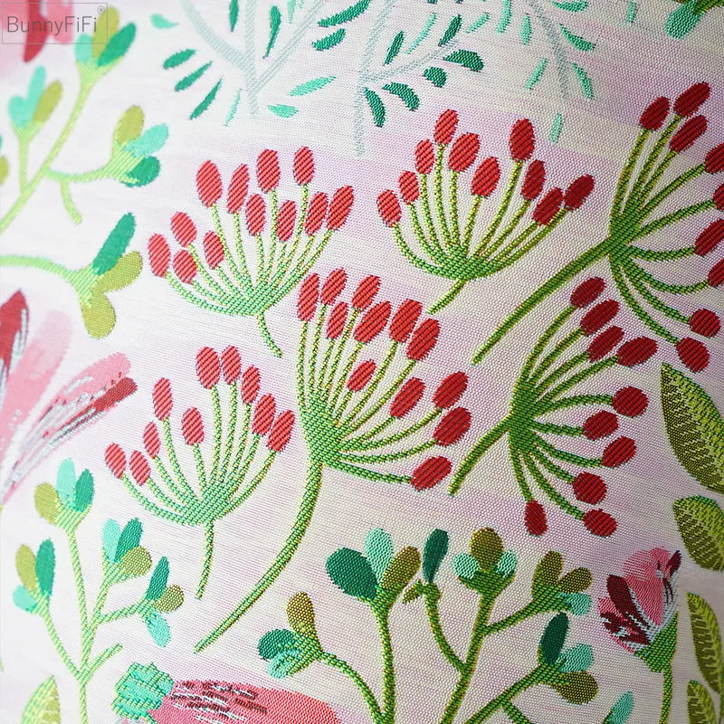 Funda de cojín DecorBites™ con estampado floral jacquard, 45x45 cm, rosa, verde y azul. Tacto suave y liso.